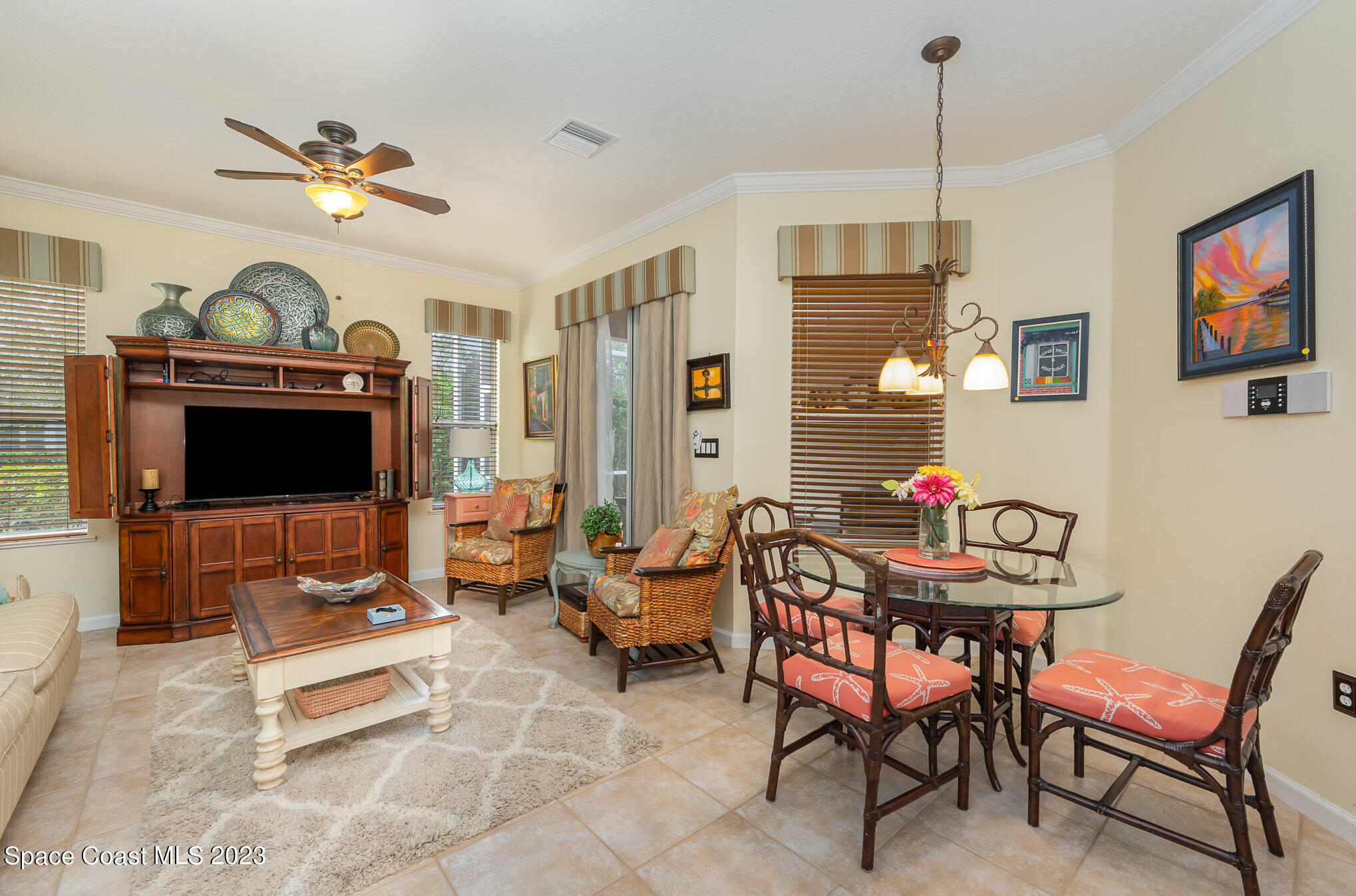 6972 Premonition Drive Melbourne, FL 32940 - Photo 14 of 33 a living room with furniture and a flat screen tv