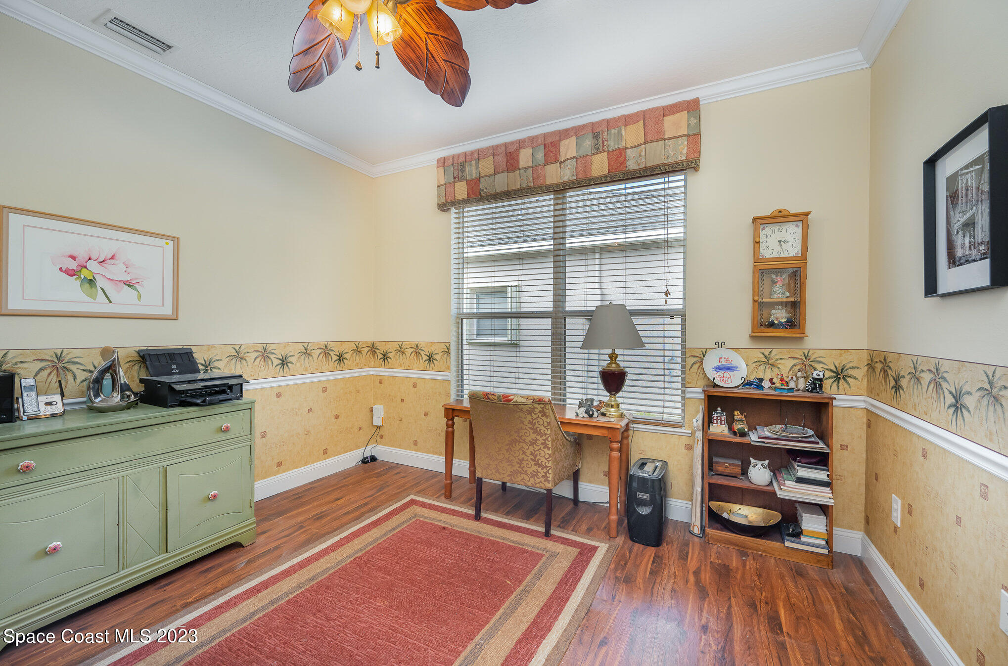 6972 Premonition Drive Melbourne, FL 32940 - Photo 23 of 33 a living room with furniture and wooden floor