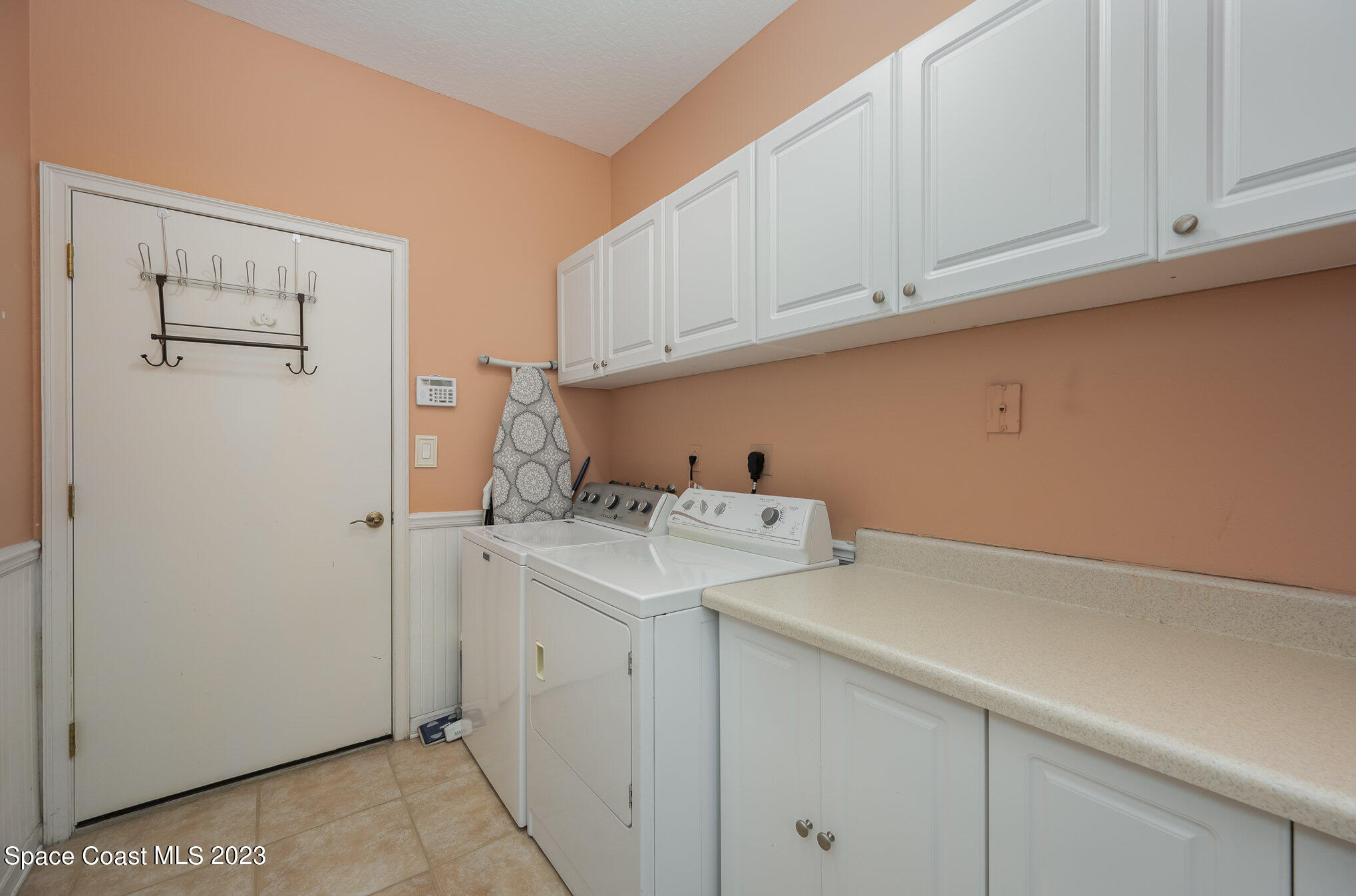 6972 Premonition Drive Melbourne, FL 32940 - Photo 29 of 33 a utility room with dryer and washer