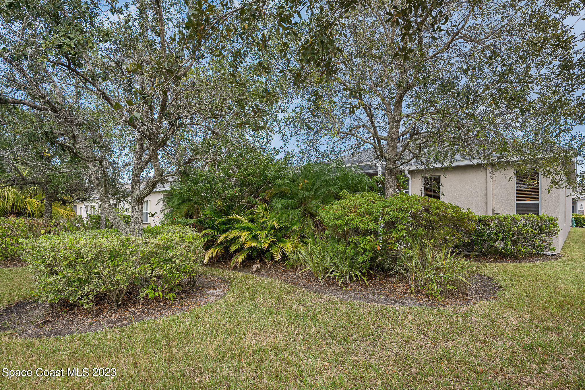 6972 Premonition Drive Melbourne, FL 32940 - Photo 33 of 33 a view of a house with a yard