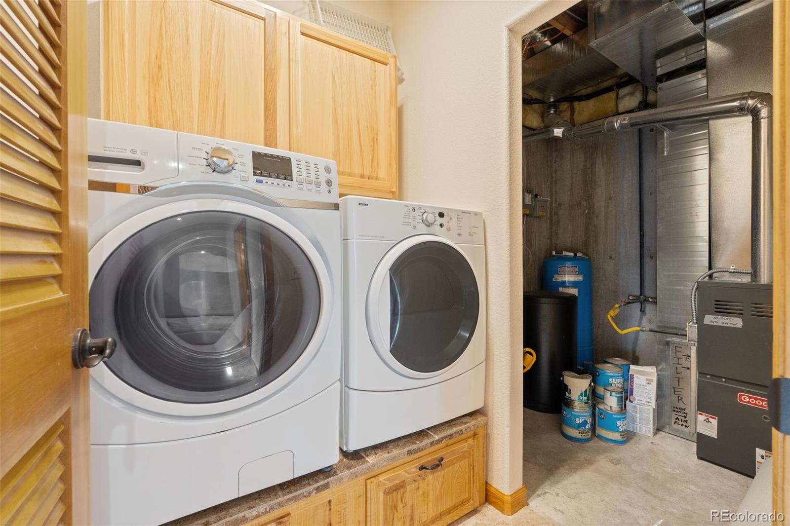 377 Deer Trail Drive Bailey, CO 80421 - Photo 25 of 44 a utility room with dryer and washer