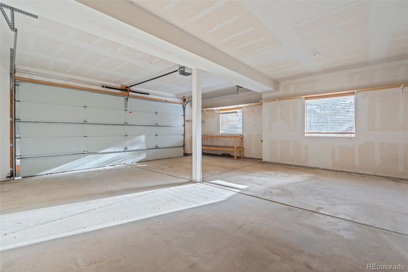 377 Deer Trail Drive Bailey, CO 80421 - Photo 26 of 44 an empty room with windows