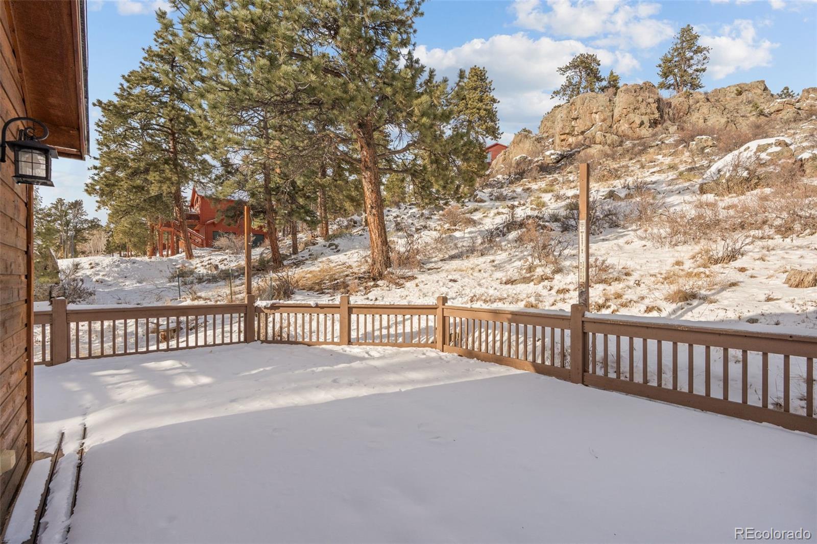 377 Deer Trail Drive Bailey, CO 80421 - Photo 27 of 44 a view of a balcony with wooden floor
