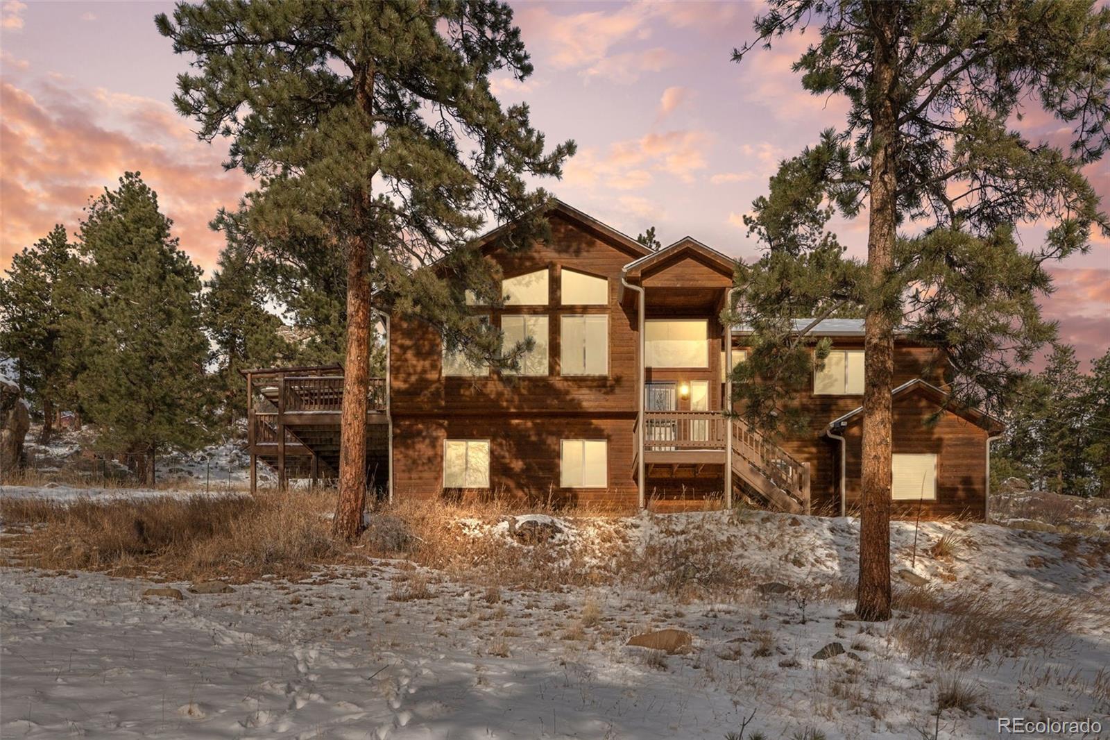 377 Deer Trail Drive Bailey, CO 80421 - Photo 44 of 44 a view of a house with a yard