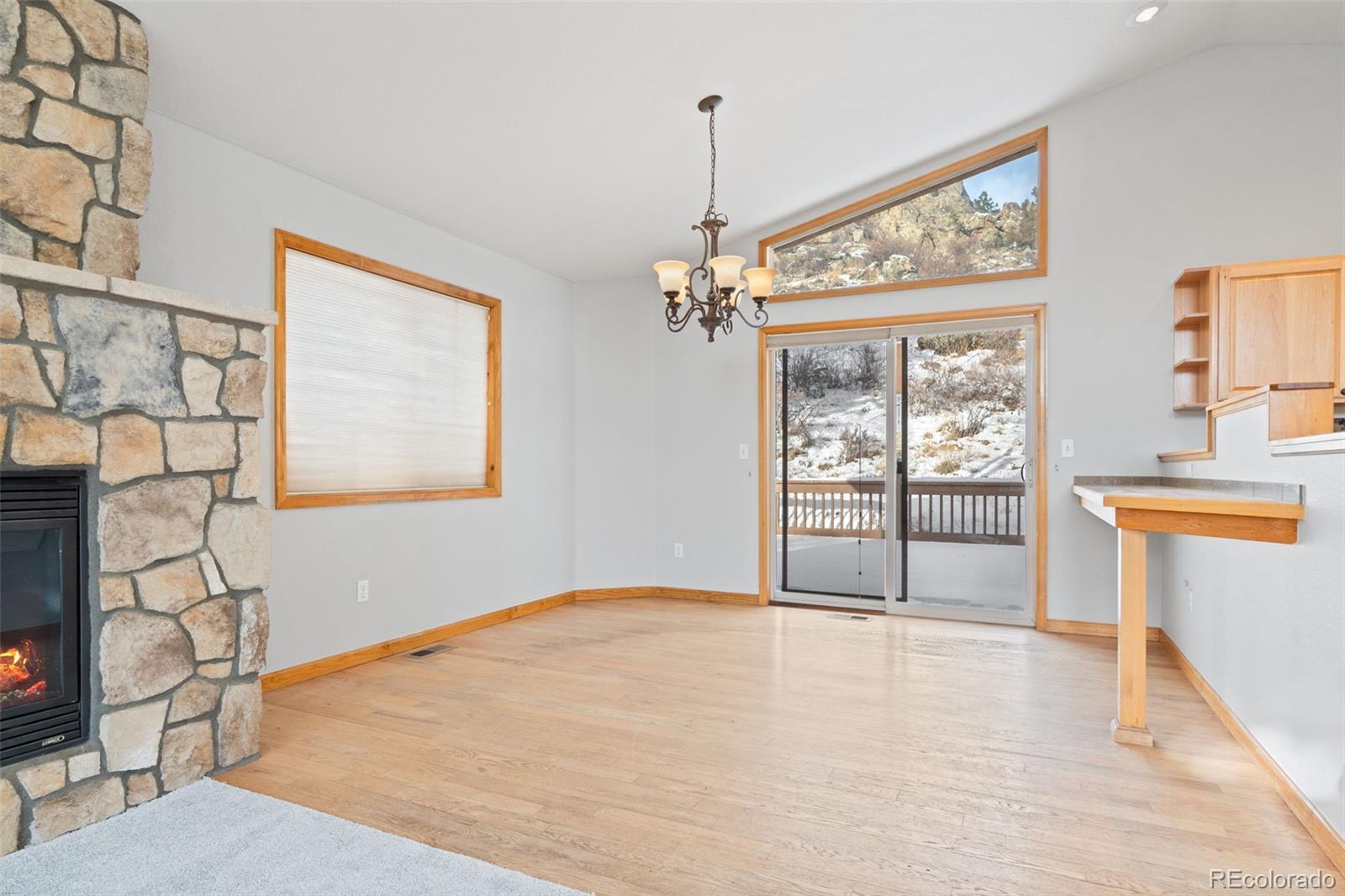 377 Deer Trail Drive Bailey, CO 80421 - Photo 9 of 44 a view of a room with wooden floor and windows