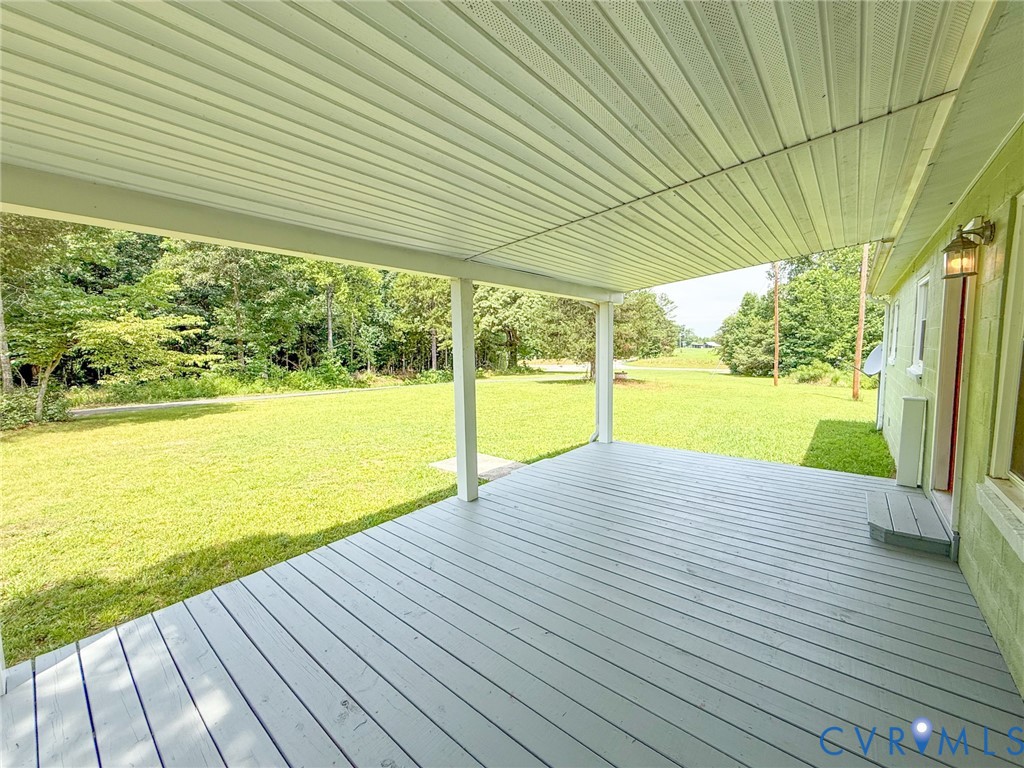 7798 West Courthouse Road Burkeville, VA 23922 - Photo 14 of 23 Spacious covered porch with plank flooring and whi