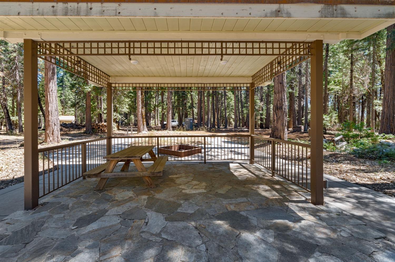 740 Hideaway Loop Alta, CA 95701 - Photo 40 of 74 a view of a porch with furniture and floor to ceiling window
