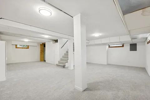 an empty room with white walls and white doors