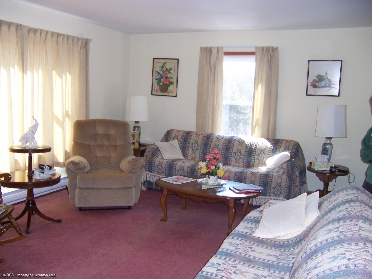 25 Cemetery Road Moscow, PA 18444 - Photo 4 of 14 a living room with furniture and a large window