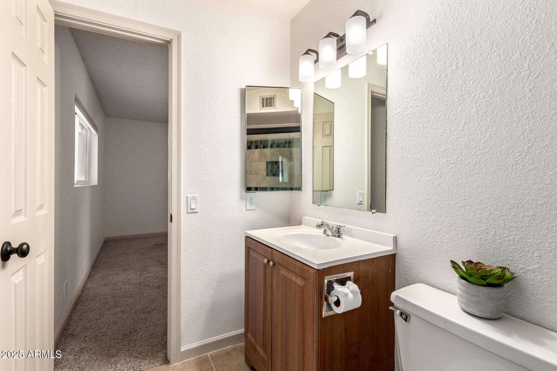 4444 West Evans Drive Glendale, AZ 85306 - Photo 26 of 35 a bathroom with a sink and a mirror