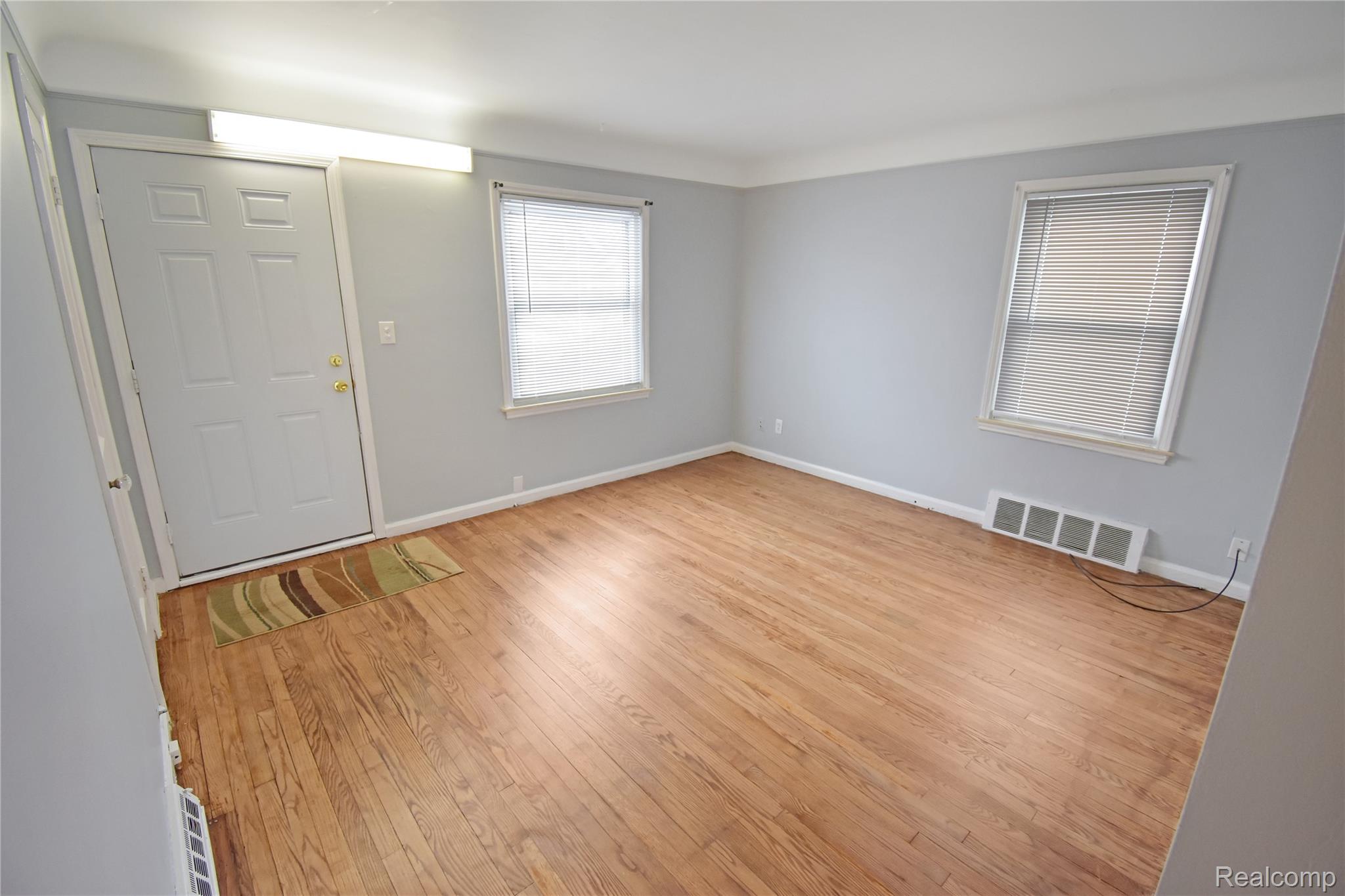 8305 Stephens Road Center Line, MI 48015 - Photo 2 of 23 Entrance foyer featuring light wood-style flooring and baseboards