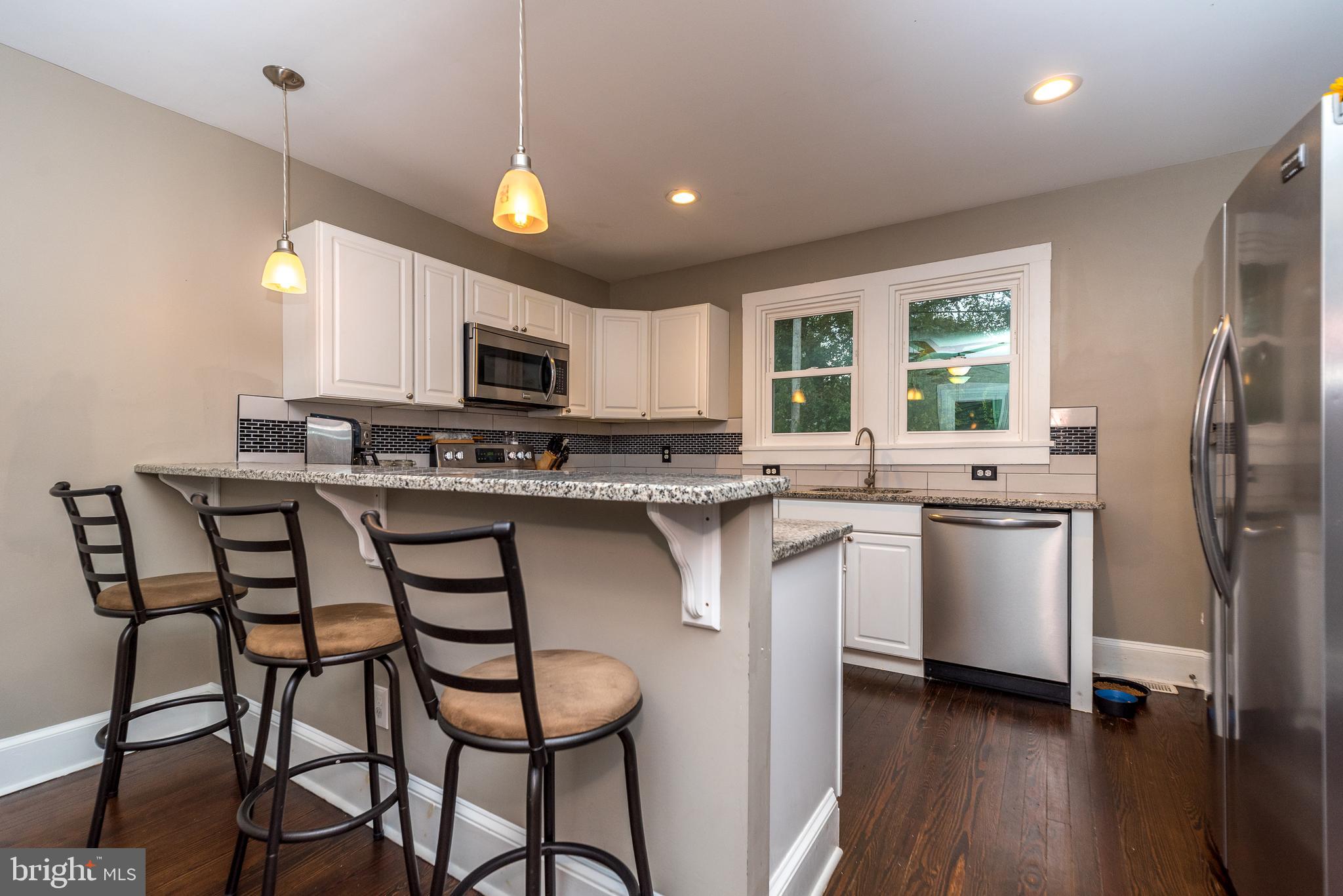 404 Dresher Road, Unit C Horsham, PA 19044 - Photo 4 of 25 Breakfast bar with pendant lighting.