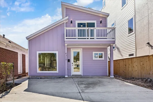 a view of kitchen with microwave and cabinets
