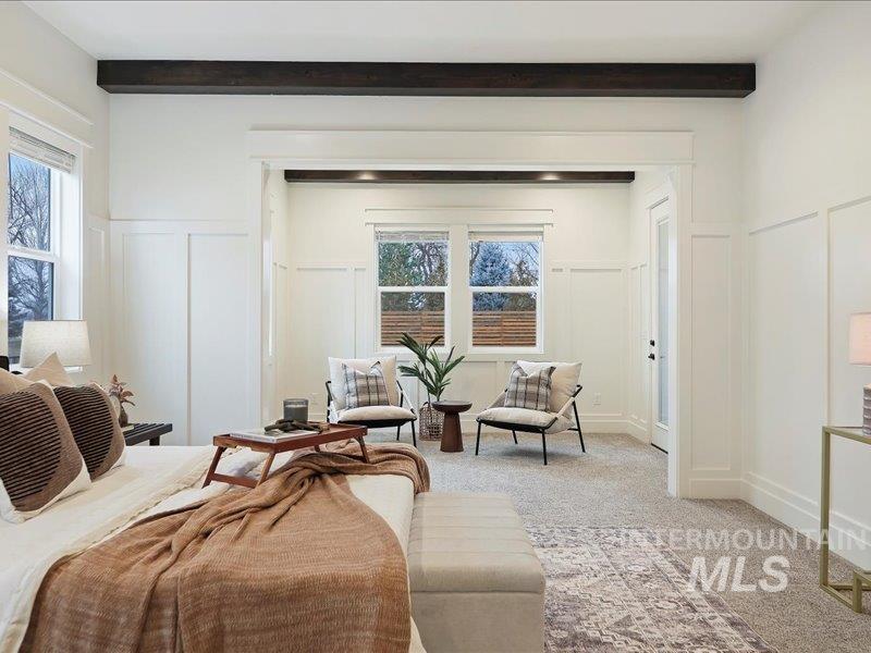 3882 West Haverhill Street Eagle, ID 83616 - Photo 22 of 38 Bedroom with a decorative wall, carpet, a wainscoted wall, and multiple windows