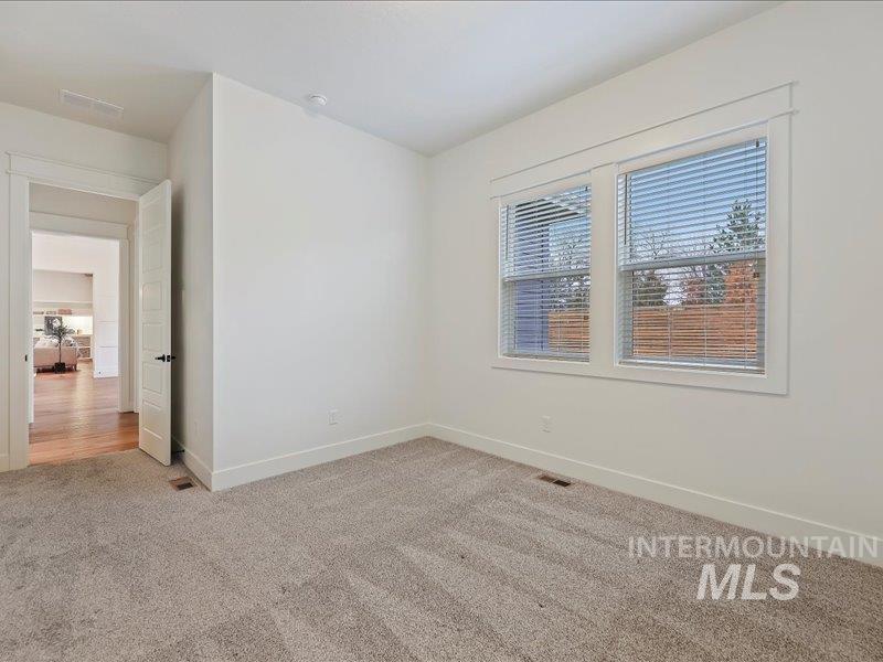 3882 West Haverhill Street Eagle, ID 83616 - Photo 28 of 38 Empty room featuring light colored carpet and baseboards