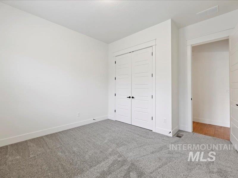 3882 West Haverhill Street Eagle, ID 83616 - Photo 32 of 38 Unfurnished bedroom featuring a closet and carpet
