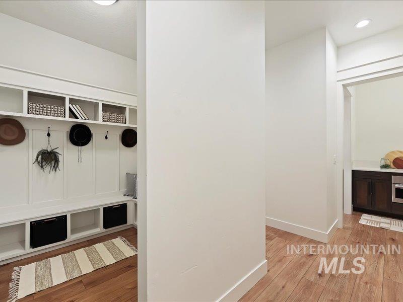 3882 West Haverhill Street Eagle, ID 83616 - Photo 34 of 38 Mudroom with light wood-style floors and baseboards