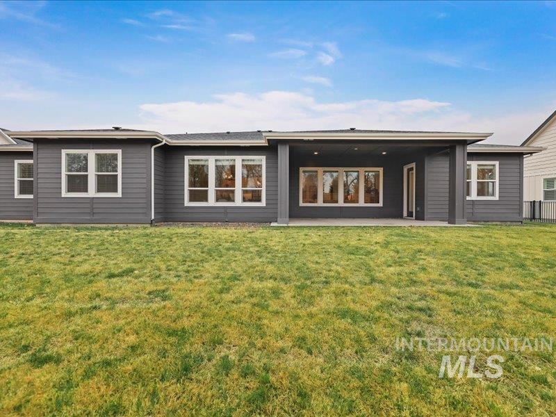 3882 West Haverhill Street Eagle, ID 83616 - Photo 37 of 38 Back of property featuring a patio and a yard