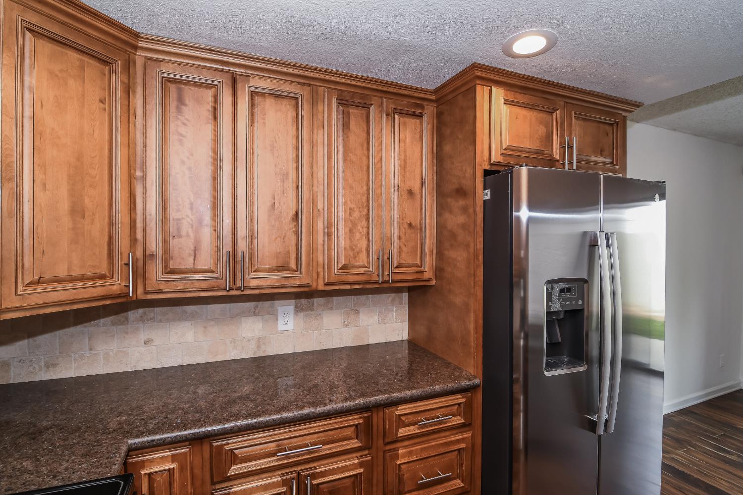 1139 Rivara Circle Sacramento, CA 95864 - Photo 23 of 72 a kitchen with stainless steel appliances granite countertop a refrigerator and a sink