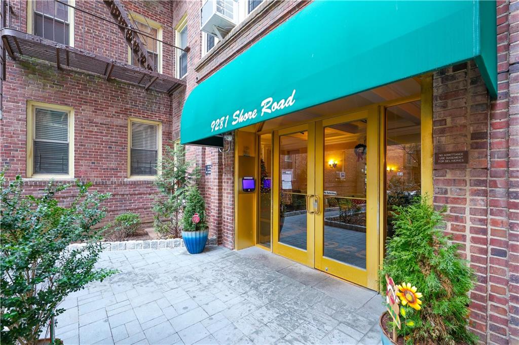 9281 Shore Road, Unit 220 Brooklyn, NY 11209 - Photo 4 of 17 a view of a building with potted plants