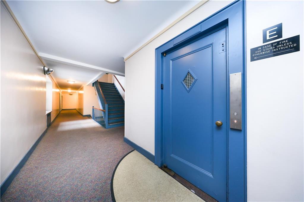 9281 Shore Road, Unit 220 Brooklyn, NY 11209 - Photo 6 of 17 a view of a hallway with closet