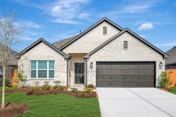 a kitchen with stainless steel appliances a sink stove and wooden floor