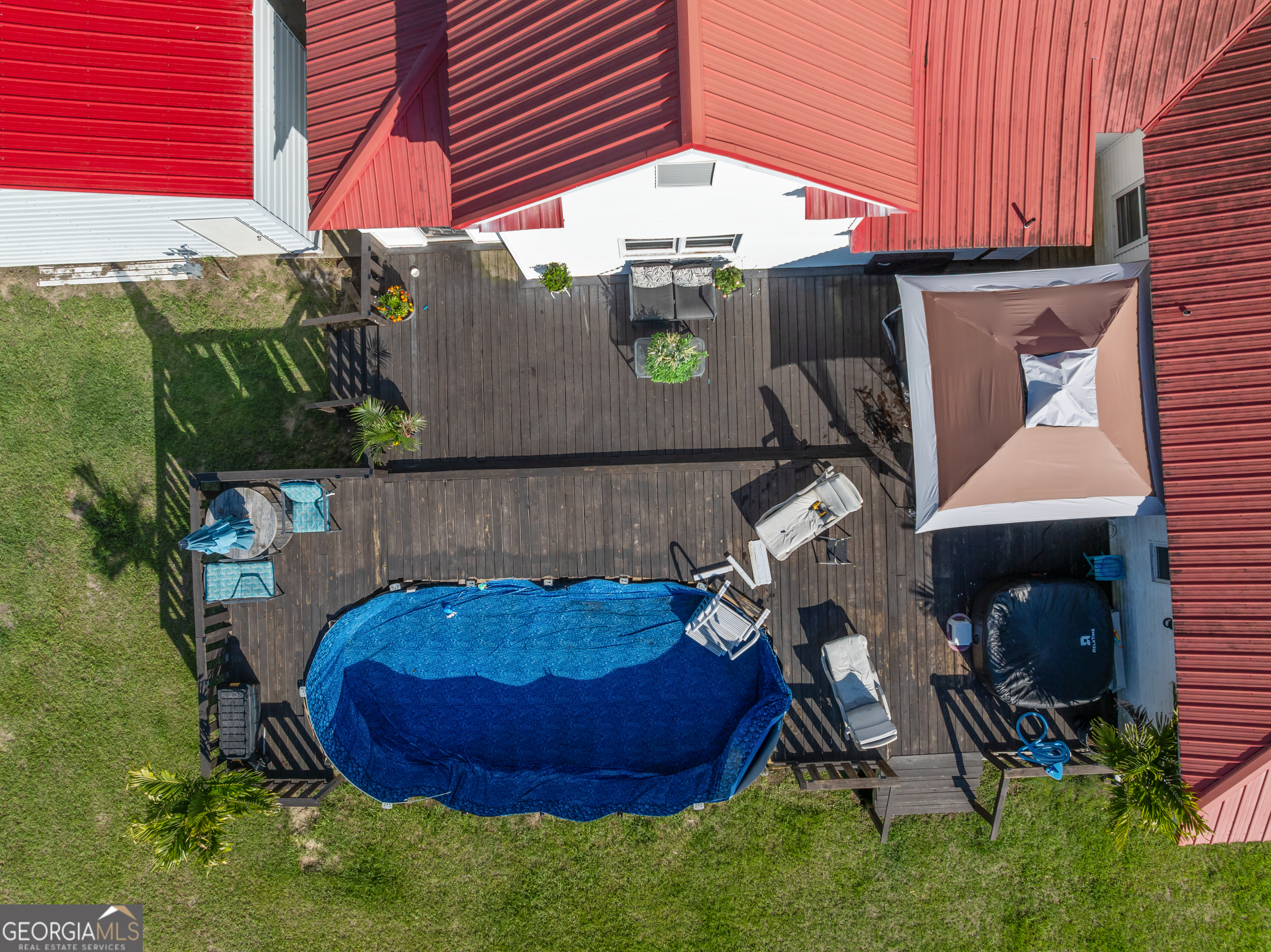 5065 10 Mile Road Baxley, GA 31513 - Photo 59 of 70 a view of a backyard with plants and a patio