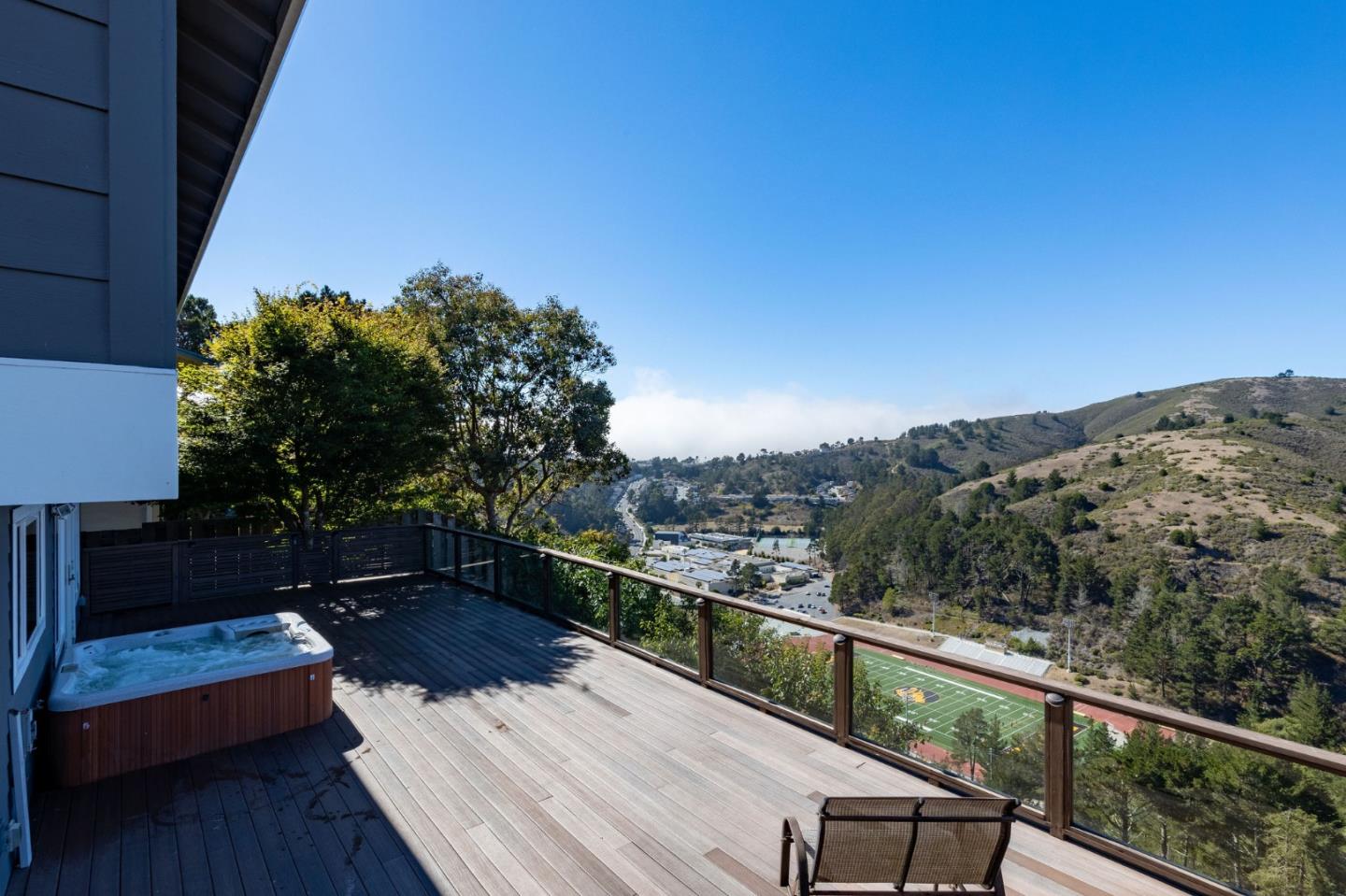 63 Kathleen Court Pacifica, CA 94044 - Photo 19 of 41 a view of a balcony with wooden floor and a bench