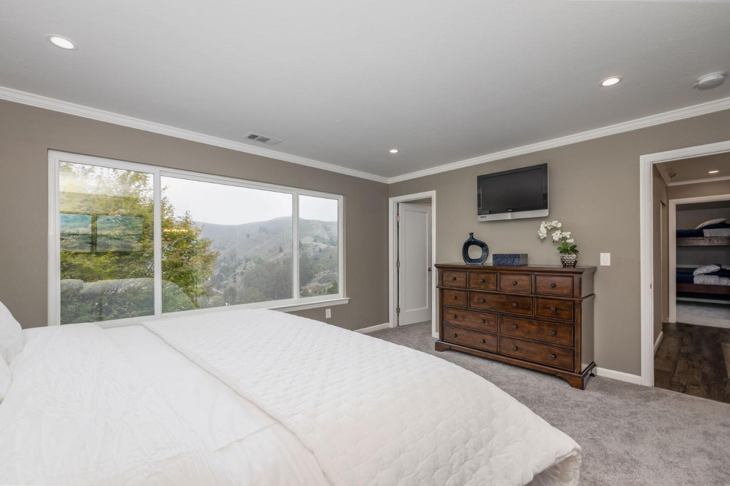 63 Kathleen Court Pacifica, CA 94044 - Photo 23 of 41 a bedroom with a bed and a large window