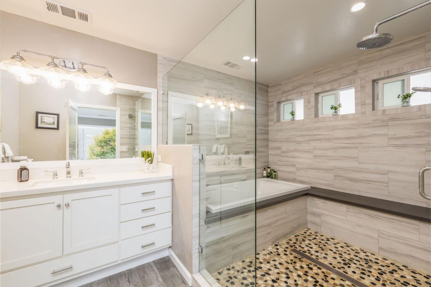 63 Kathleen Court Pacifica, CA 94044 - Photo 25 of 41 a bathroom with a double vanity sink a mirror and a shower
