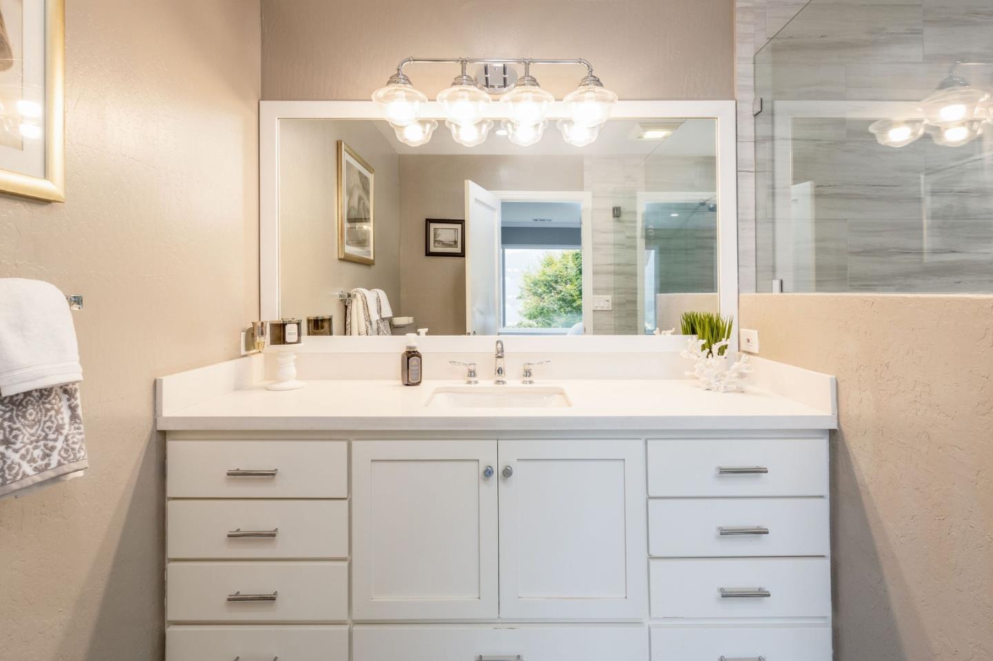 63 Kathleen Court Pacifica, CA 94044 - Photo 26 of 41 a bathroom with a sink and a mirror