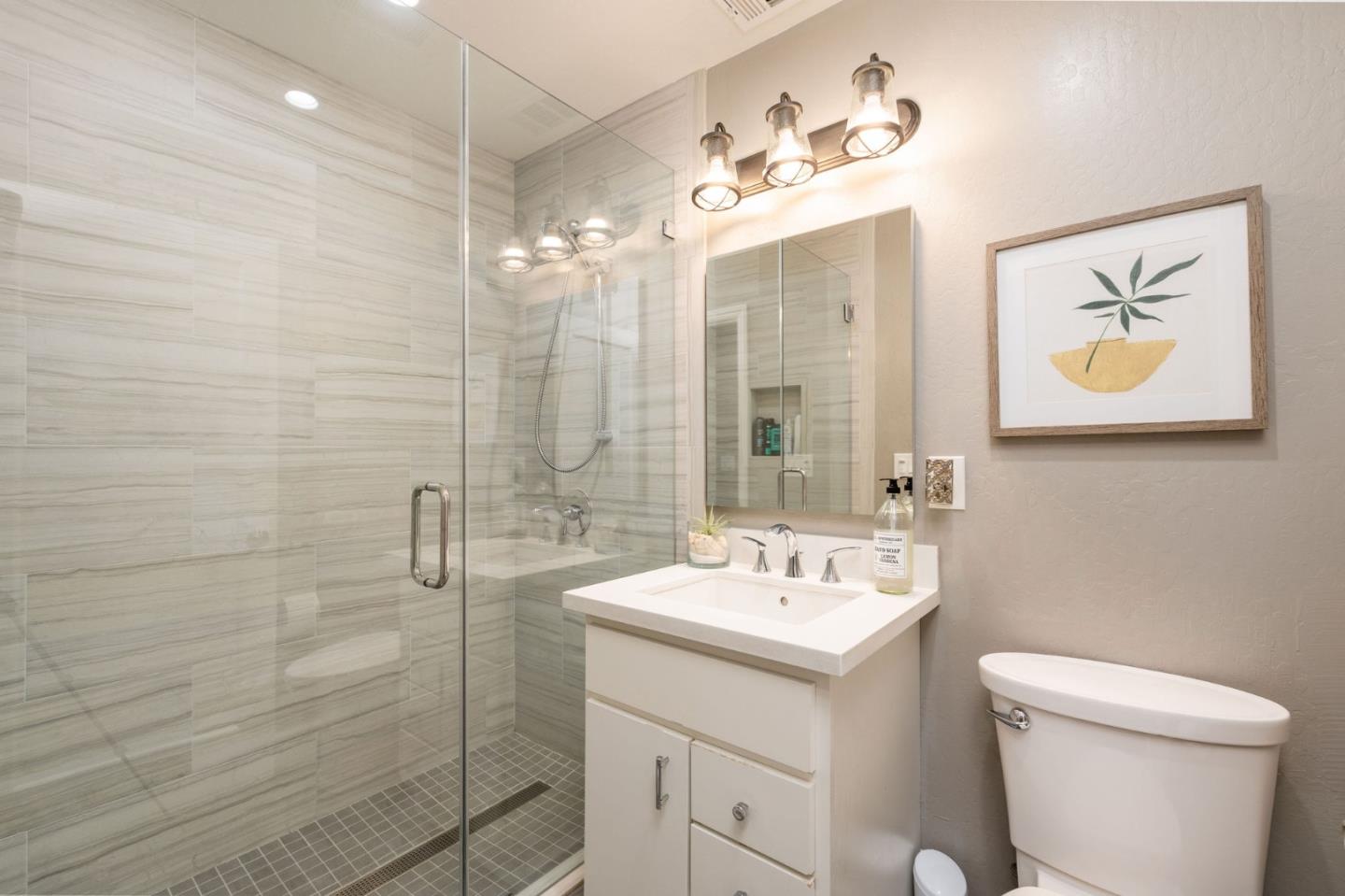 63 Kathleen Court Pacifica, CA 94044 - Photo 28 of 41 a bathroom with a double vanity sink mirror and toilet