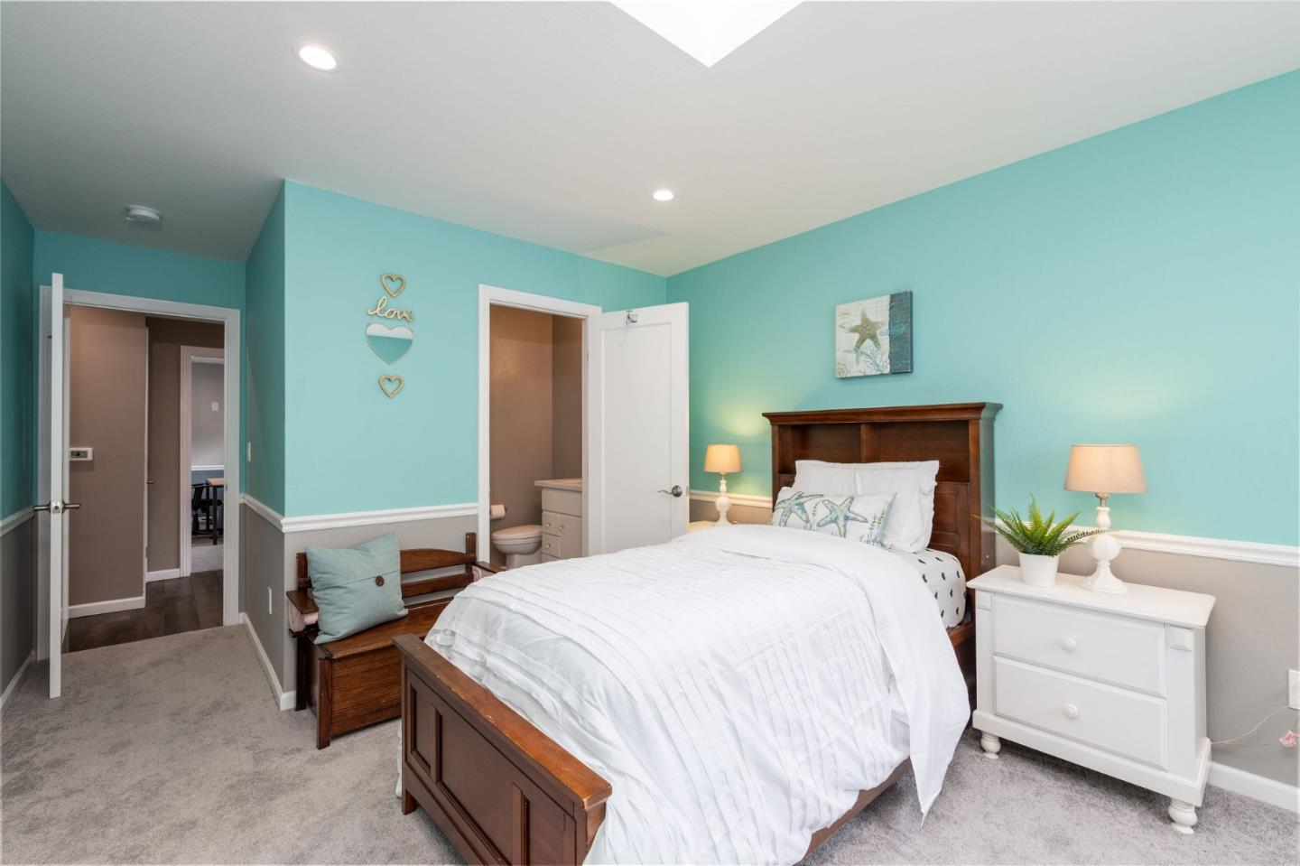 63 Kathleen Court Pacifica, CA 94044 - Photo 31 of 41 a bedroom with a bed and a table