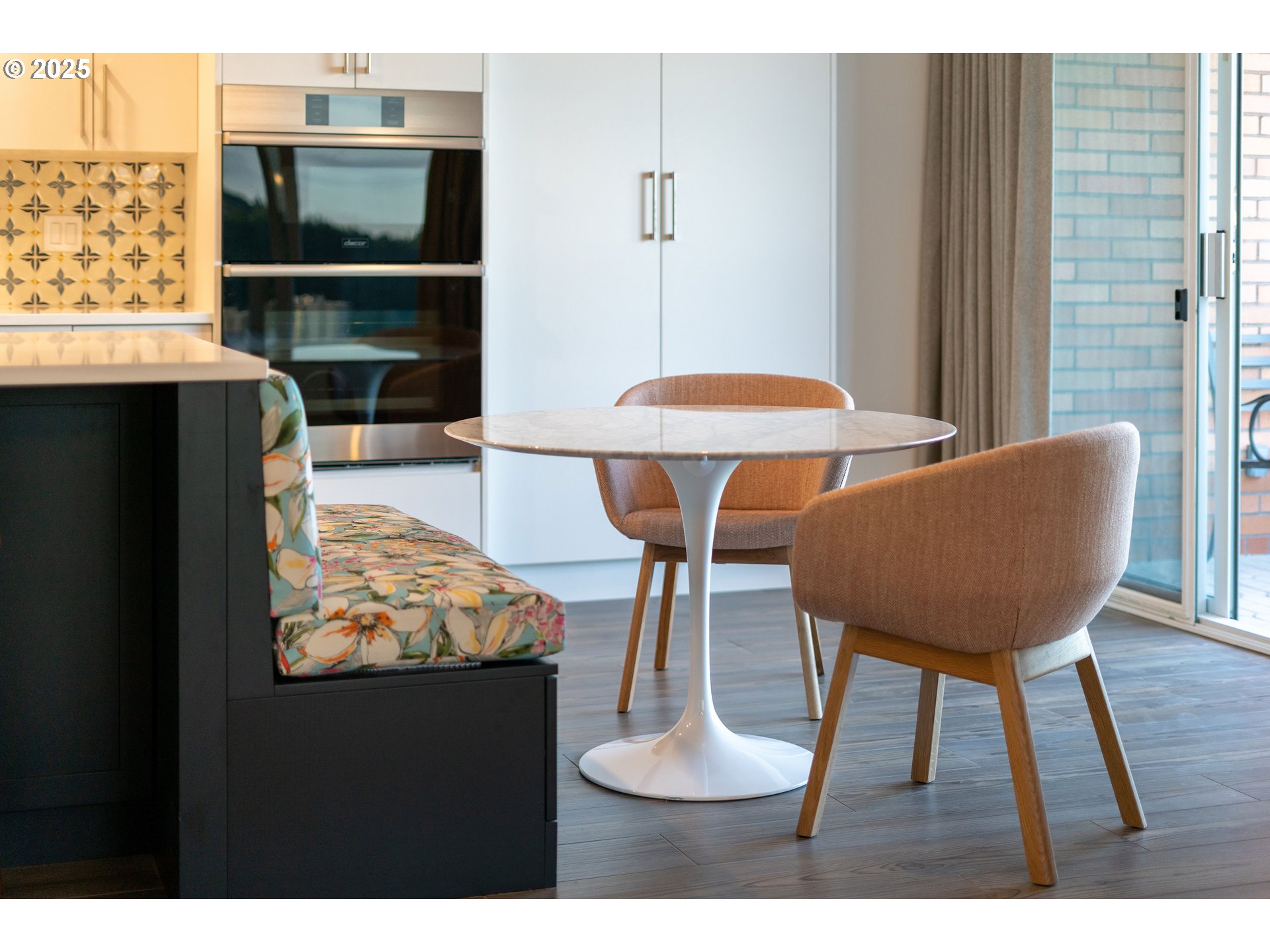 1414 Southwest 3rd Avenue, Unit 2902 Portland, OR 97201 - Photo 12 of 45 a view of a dining room with furniture and wooden floor