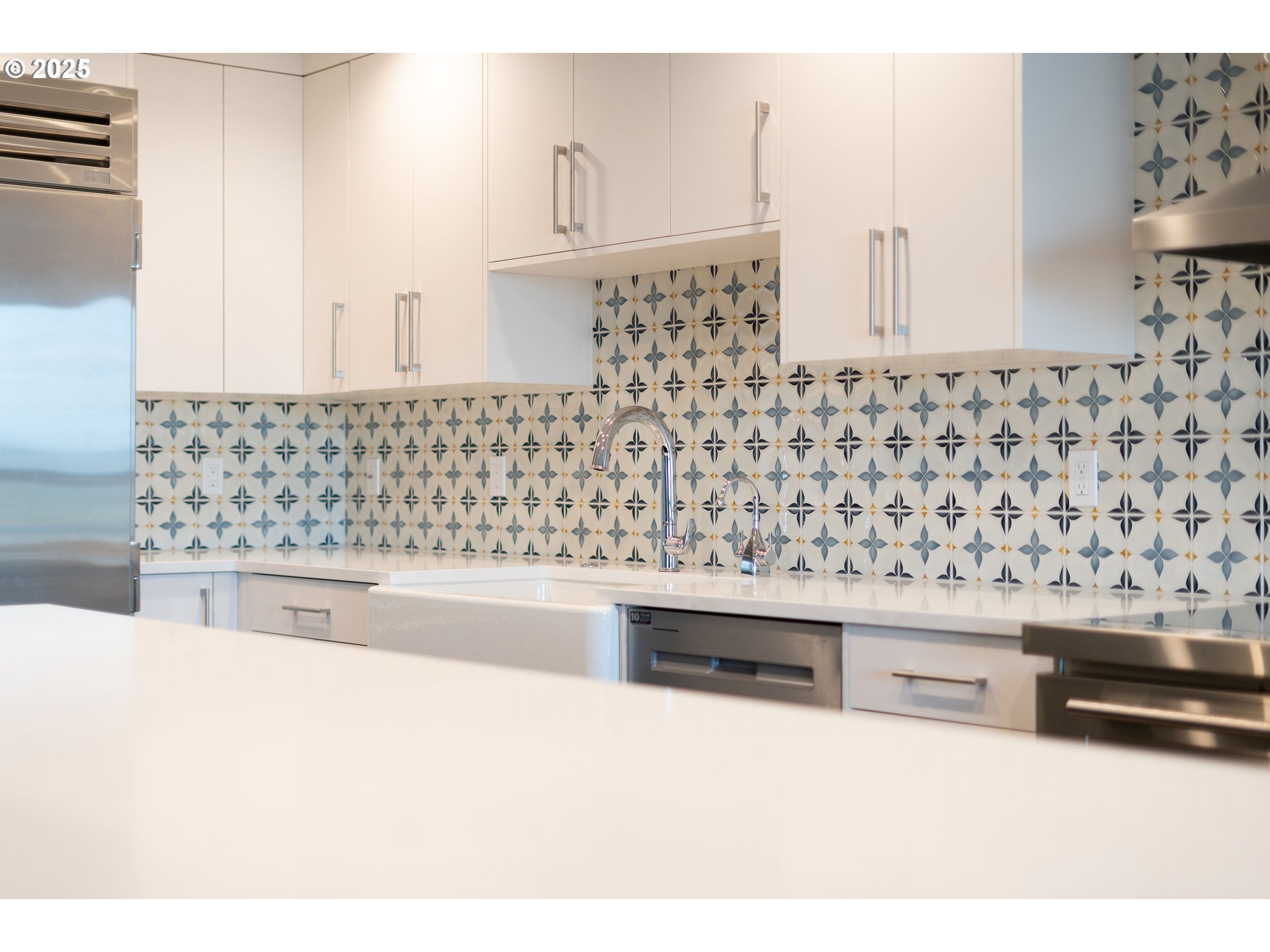 1414 Southwest 3rd Avenue, Unit 2902 Portland, OR 97201 - Photo 16 of 45 a kitchen with a stove a sink and a refrigerator