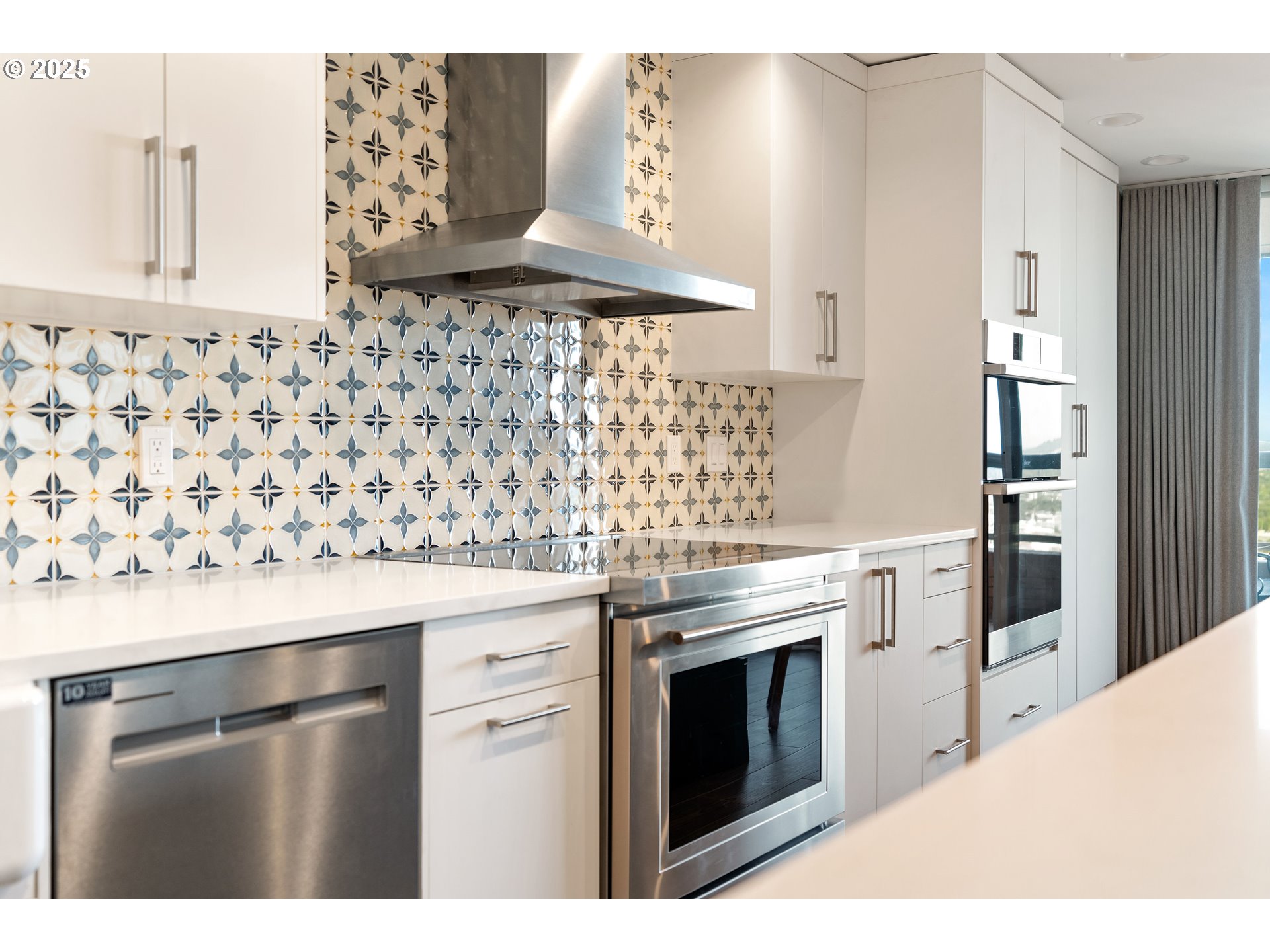 1414 Southwest 3rd Avenue, Unit 2902 Portland, OR 97201 - Photo 21 of 45 a kitchen with stainless steel appliances a stove and a refrigerator