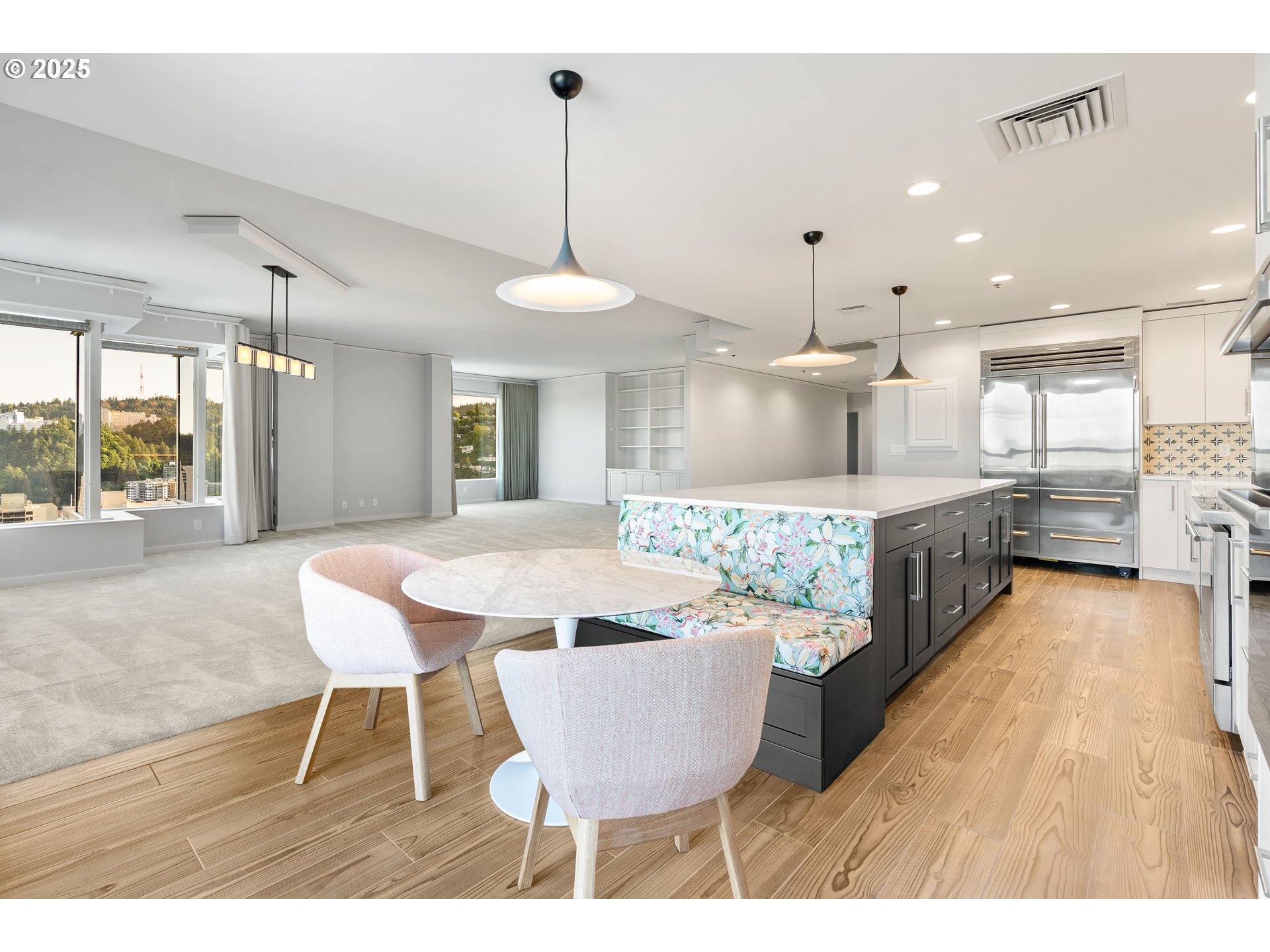 1414 Southwest 3rd Avenue, Unit 2902 Portland, OR 97201 - Photo 23 of 45 a large kitchen with a table and chairs