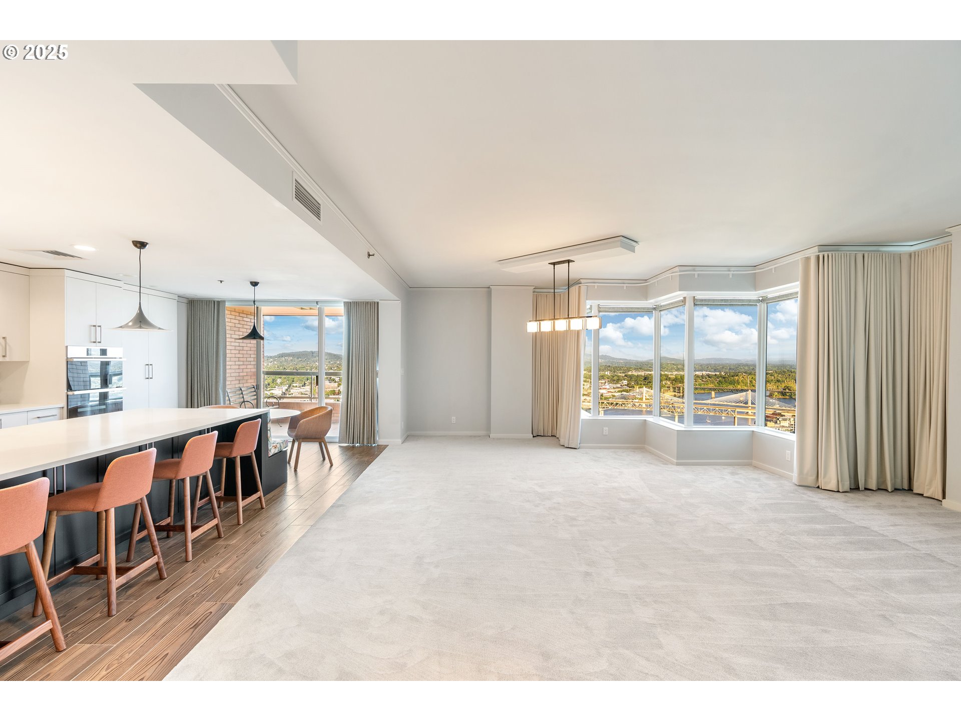 1414 Southwest 3rd Avenue, Unit 2902 Portland, OR 97201 - Photo 4 of 45 a large white kitchen with lots of counter space and stainless steel appliances