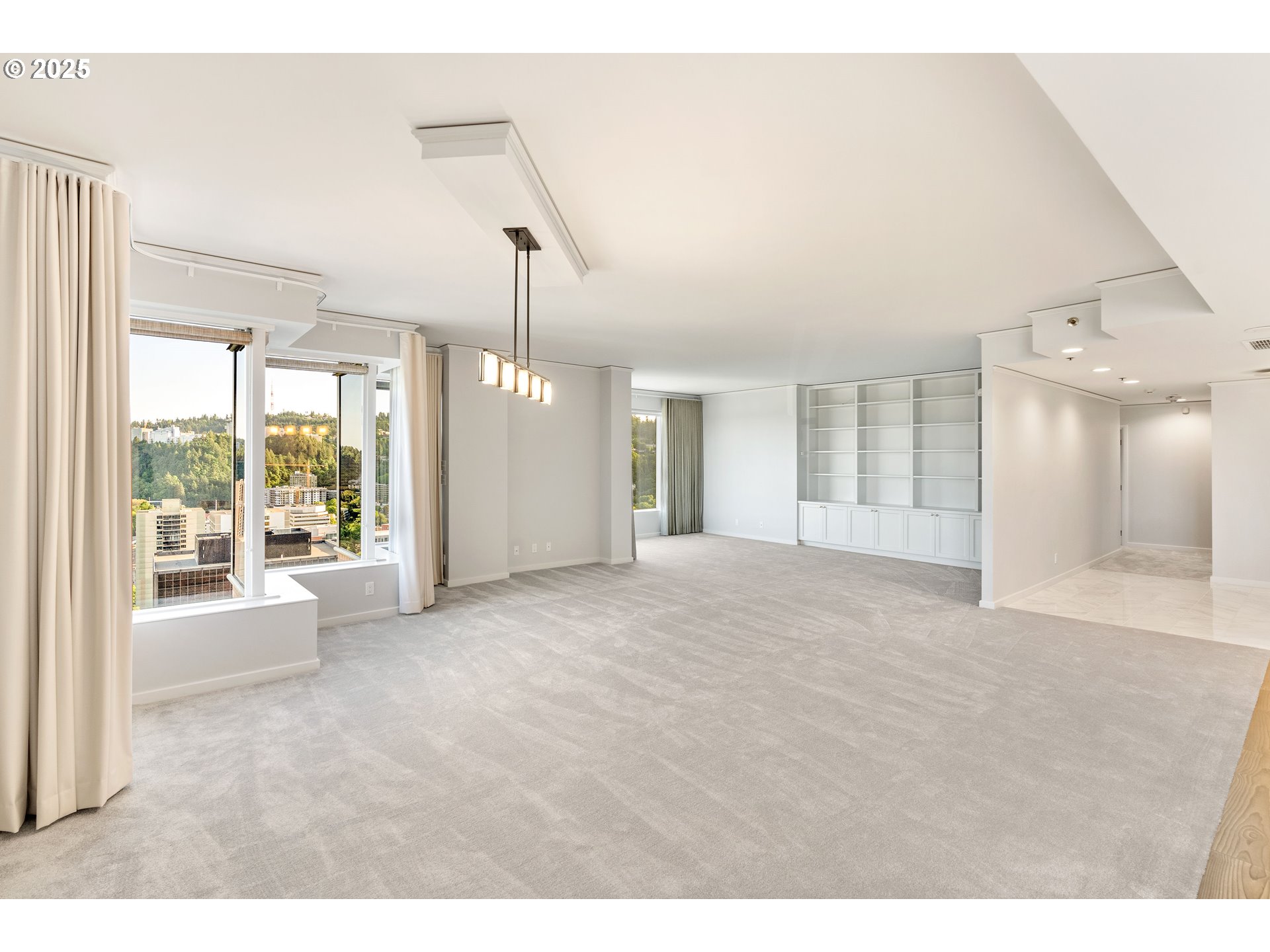 1414 Southwest 3rd Avenue, Unit 2902 Portland, OR 97201 - Photo 7 of 45 a view of a big room with windows and chandelier