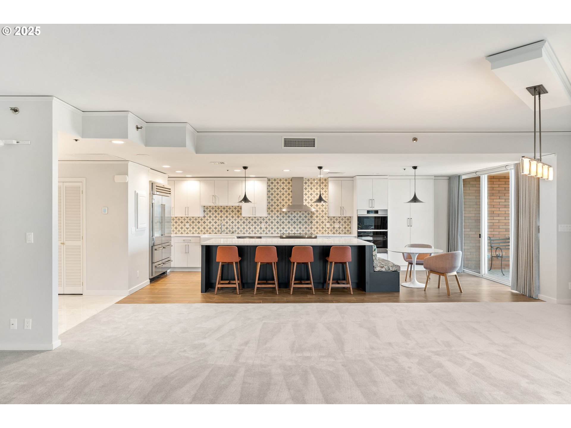 1414 Southwest 3rd Avenue, Unit 2902 Portland, OR 97201 - Photo 10 of 45 a view of an empty room with kitchen and a window