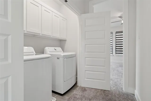 a bathroom with a sink and cabinets