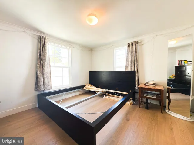 a living room with projector and a flat screen tv