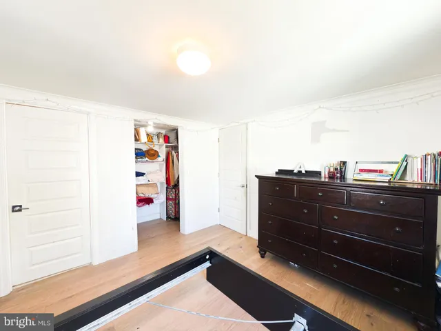 a room with a cabinet and book shelf