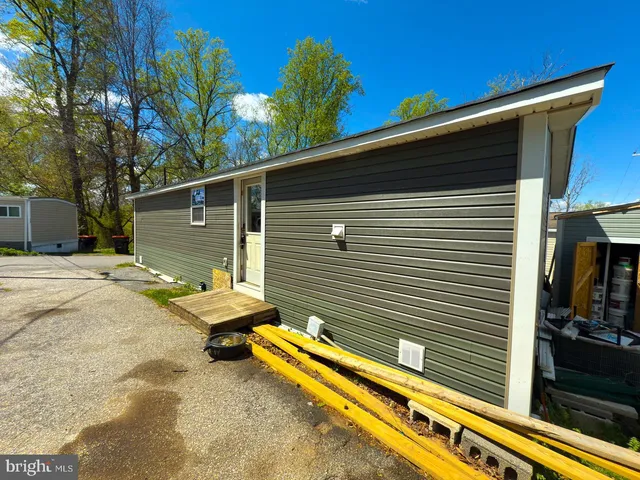 a backyard of a house with seating space