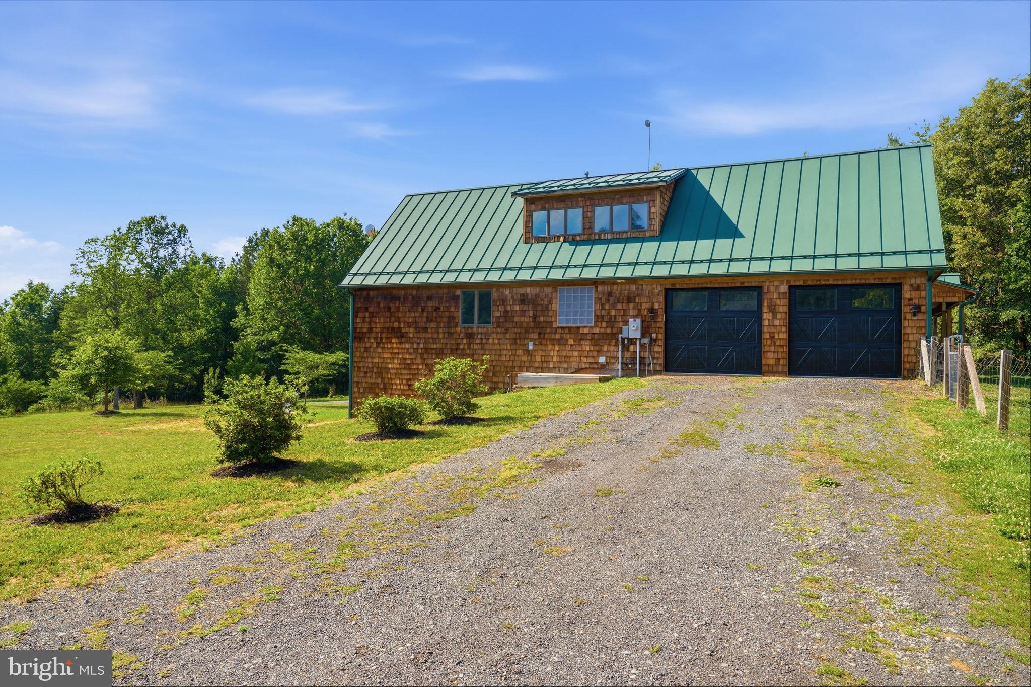 7522 Stubbs Bridge Road Spotsylvania, VA 22551 - Photo 59 of 60 a front view of a house with a yard