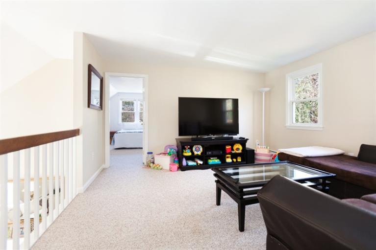 276 Bumps River Road Osterville, MA 02655 - Photo 18 of 29 a living room with furniture and a flat screen tv