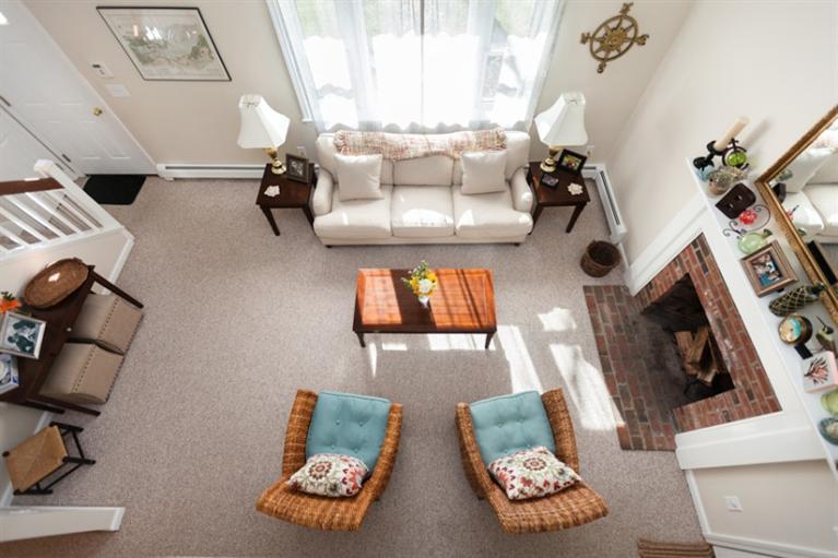 276 Bumps River Road Osterville, MA 02655 - Photo 23 of 29 a living room with furniture and a fireplace