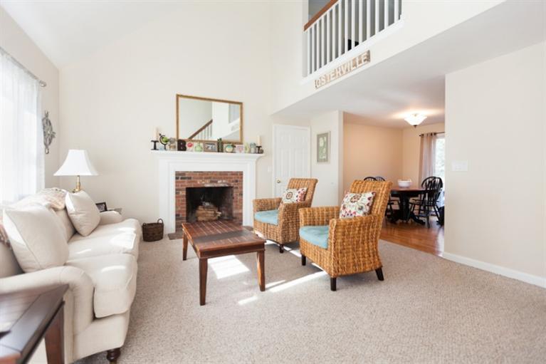 276 Bumps River Road Osterville, MA 02655 - Photo 4 of 29 a living room with furniture and a fireplace