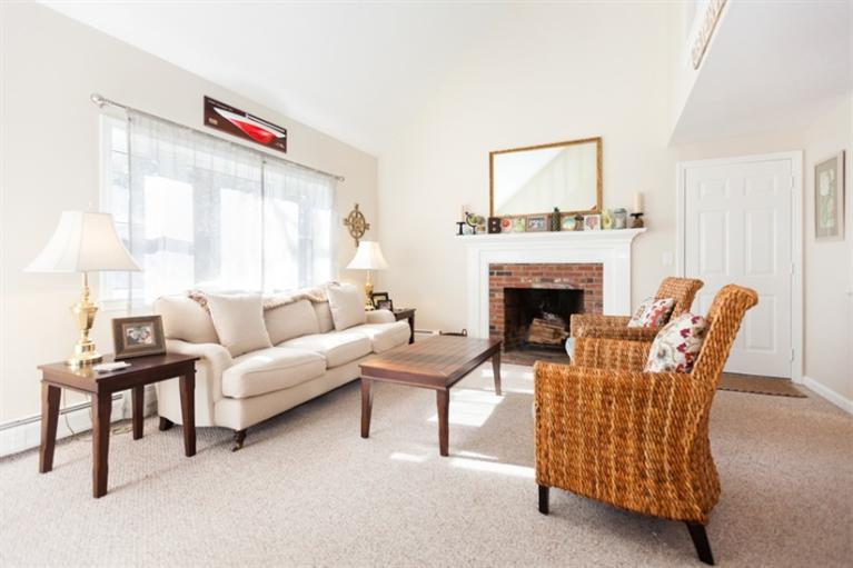 276 Bumps River Road Osterville, MA 02655 - Photo 5 of 29 a living room with furniture and a fireplace