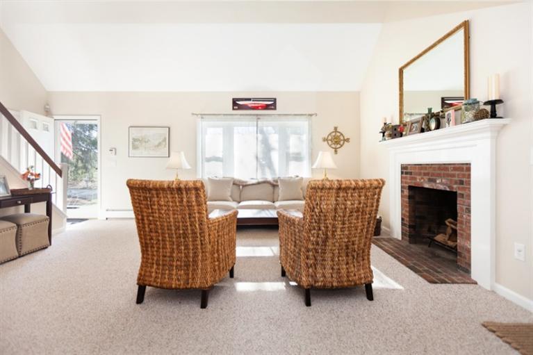 276 Bumps River Road Osterville, MA 02655 - Photo 9 of 29 a living room with furniture and a fireplace
